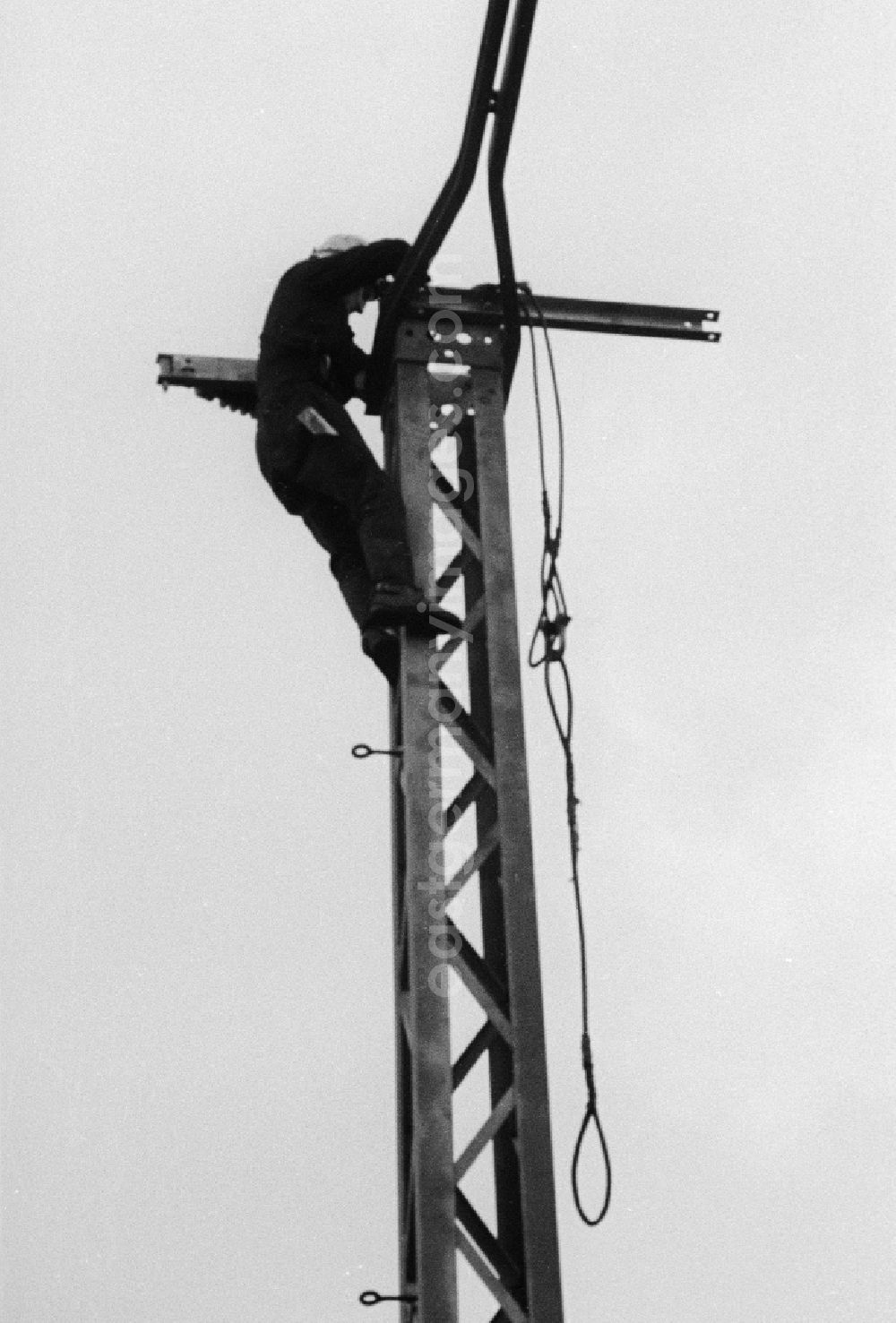 Seddiner See: An employee of the German national railway mounts to driving poles in the railway station Seddin the direction in Seddiner See in the federal state Brandenburg in the area of the former GDR, German democratic republic