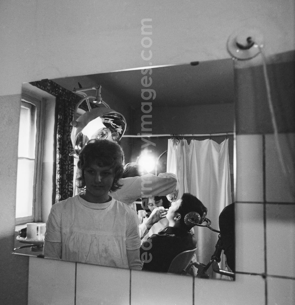 GDR photo archive: Strausberg - A soldier of the NVA with a treatment at the dentist in Strausberg in what is now the state of Brandenburg