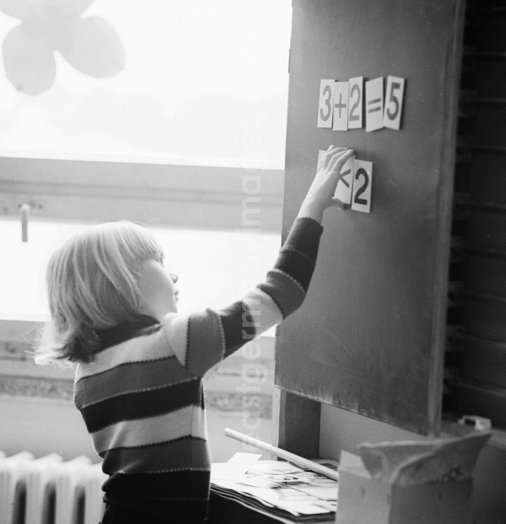 GDR image archive: Berlin - A student stands at the blackboard and solve math problems, in Berlin