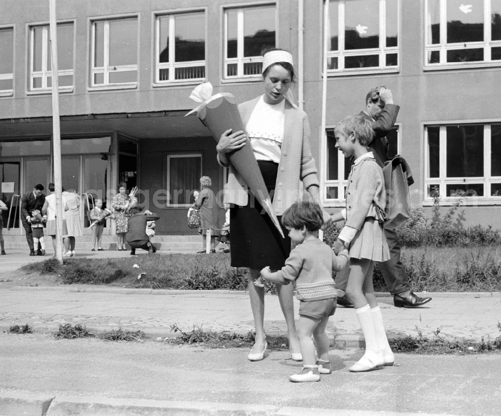 Berlin: A girl proudly holds her sugar bag on the day of school enrolment in Berlin, the former capital of the GDR, German Democratic Republic
