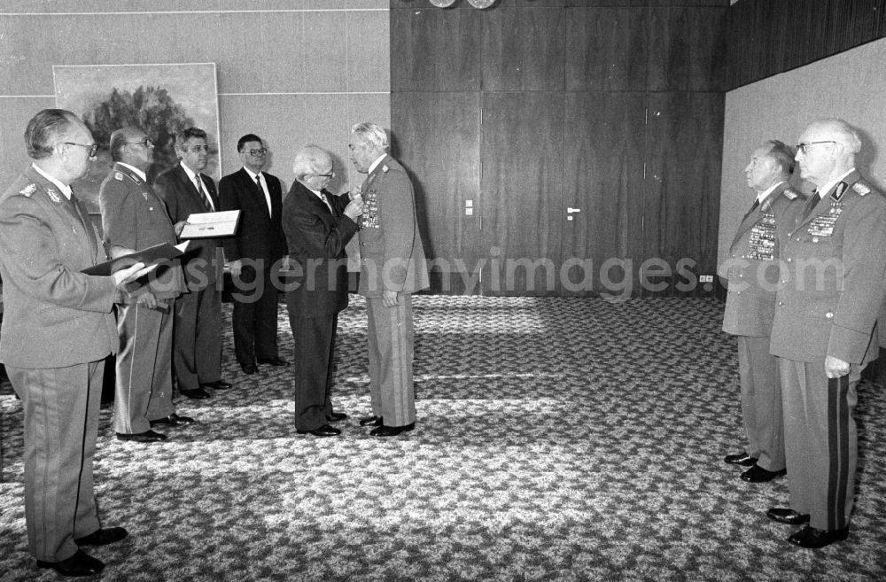 GDR picture archive: Berlin - Ceremony for the appointment and promotion of colonels and generals in the State Council building by the Chairman of the State Council and General Secretary of the SED Central Committee Erich Honecker in the presence of Defense Minister Army General Heinz Hoffmann and Egon Krenz in the Mitte district of Berlin East Berlin on the territory of the former GDR, German Democratic Republic