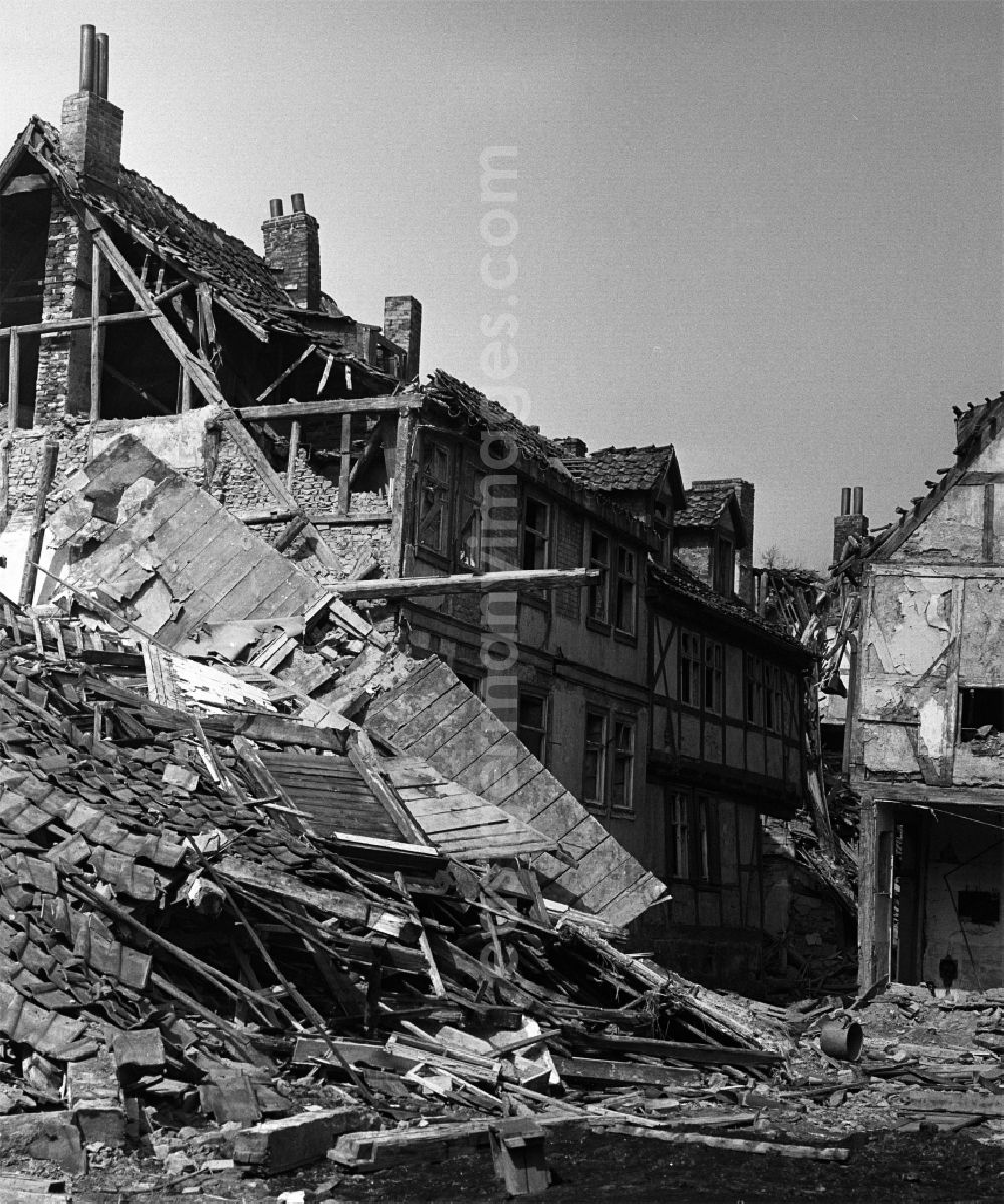 GDR picture archive: Halberstadt - Rubble and ruins Rest of the facade and roof structure of the half-timbered house am Seidenbeutel by demolition in Halberstadt in the state Saxony-Anhalt on the territory of the former GDR, German Democratic Republic