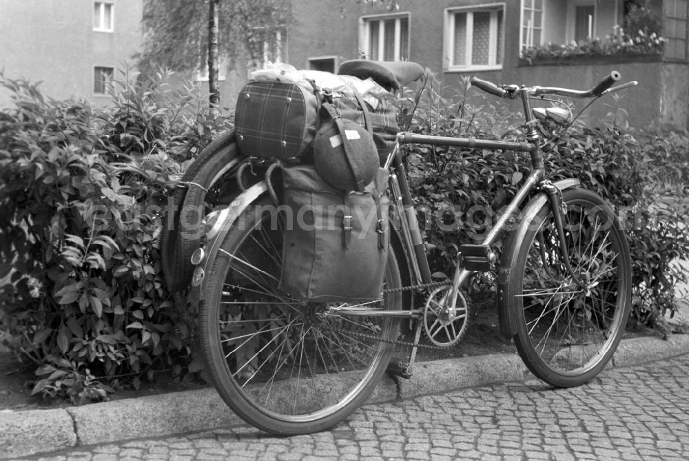 Berlin - Mitte: A men's bicycle is packed with Panniers on the edge of a sidewalk in Berlin
