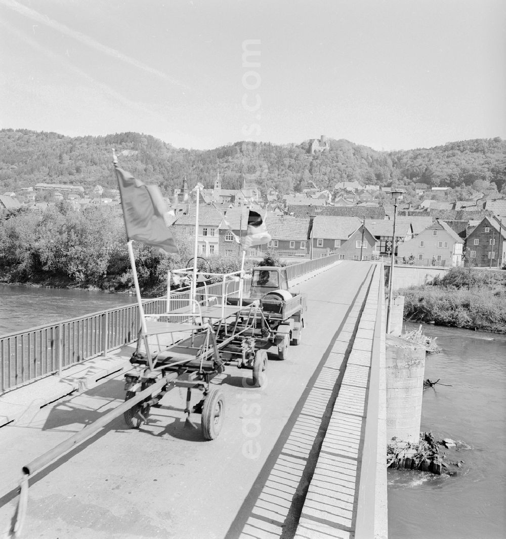 GDR photo archive: Treffurt - A vehicle on the Werra bridge in Treffurt in the state of Thuringia on the territory of the former GDR, German Democratic Republic