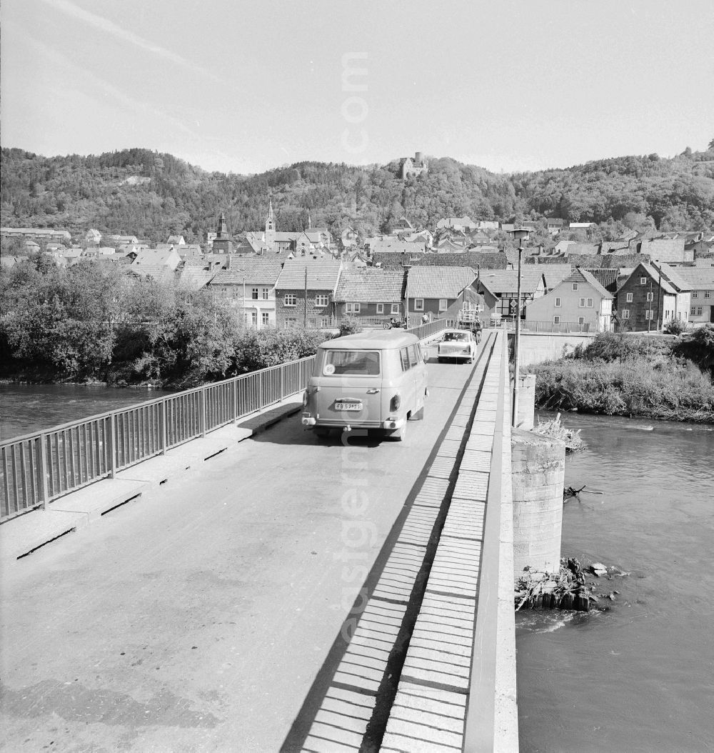 GDR picture archive: Treffurt - A vehicle on the Werra bridge in Treffurt in the state of Thuringia on the territory of the former GDR, German Democratic Republic