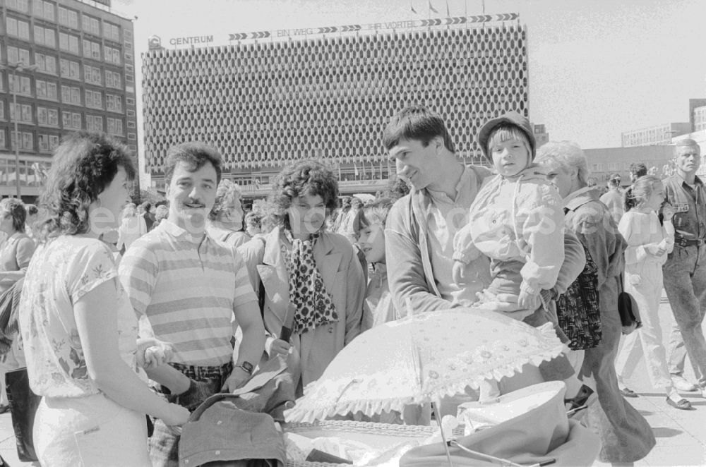 GDR picture archive: Berlin - Families with strollers at the fair for public entertainment during the 1st of may at the Alexanderplatz in Berlin in Germany