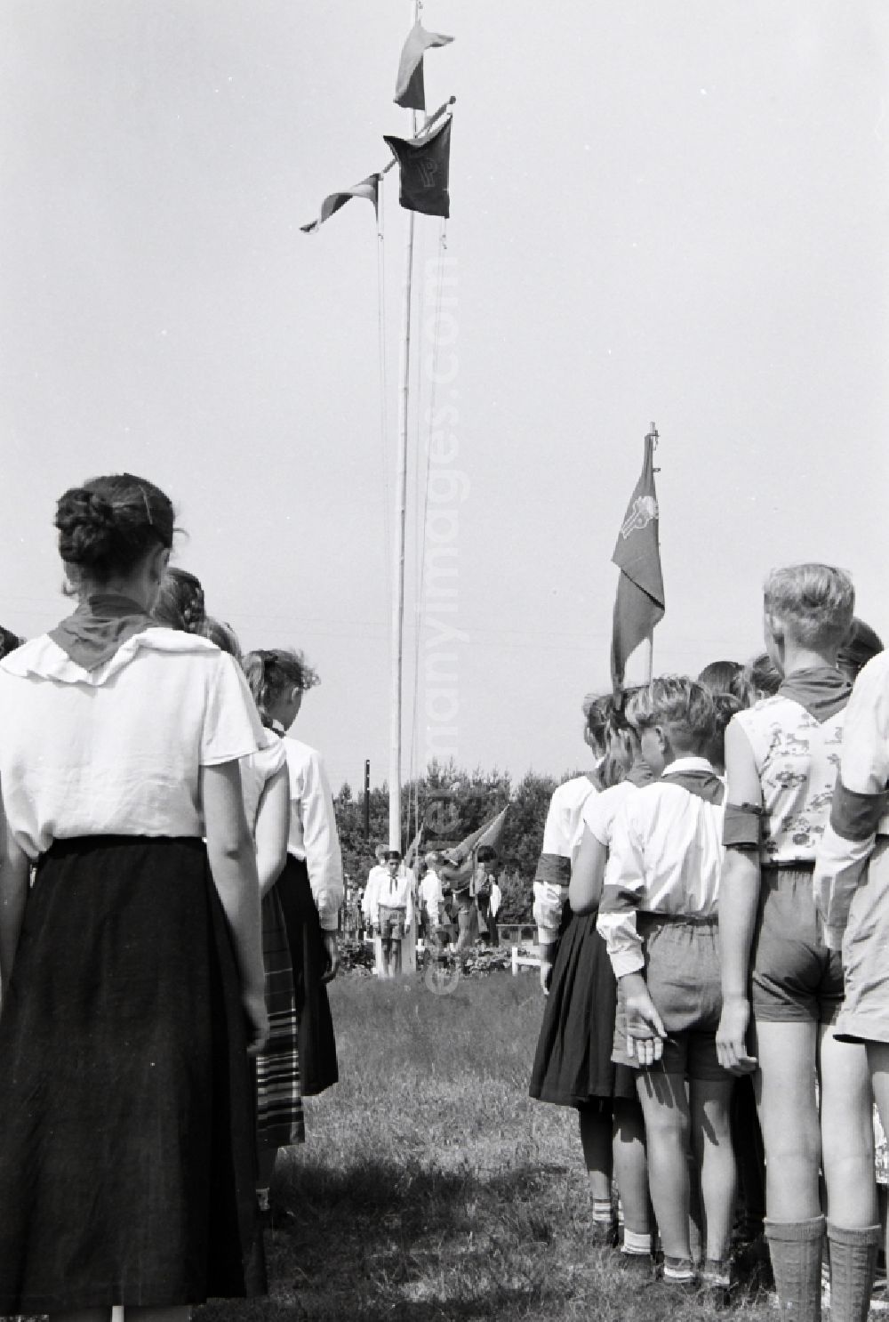 GDR image archive: Prerow - Summer camp operation with pupils and teenagers in the summer camp Kim Ir Sen of the pioneer organization Ernst Thaelmann in Prerow in the state Mecklenburg-Western Pomerania on the territory of the former GDR, German Democratic Republic. With homemade phantasy uniforms and pre-military drill and ante-exercises, the communist tradition was commemorated in the Spanish Civil War