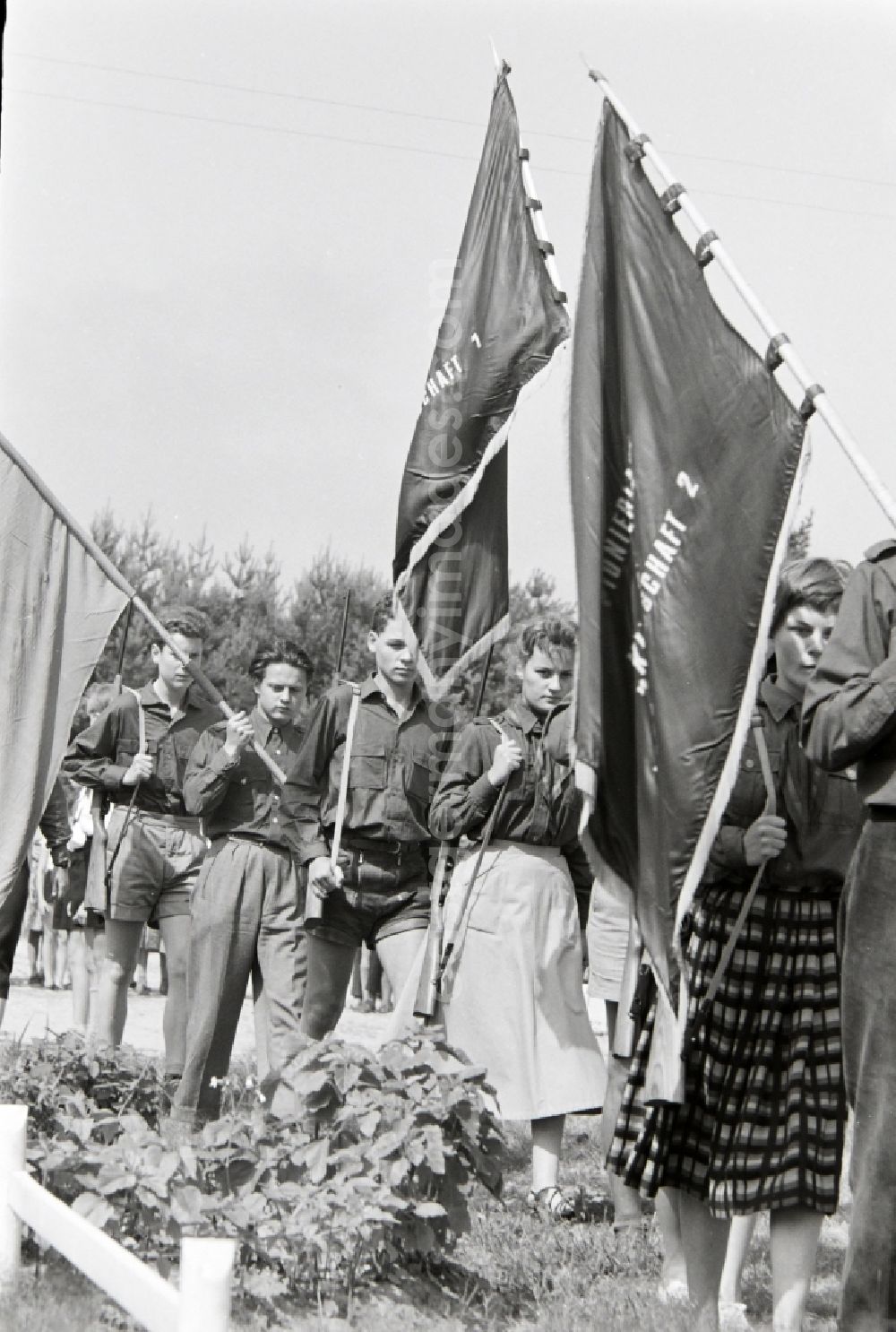 GDR photo archive: Prerow - Day Appell in summer camp with students and youth in FDJ uniform with flags and banners in the summer camp Kim Ir Sen of the pioneer organization Ernst Thalmann in Prerow in the state Mecklenburg-Western Pomerania on the territory of the former GDR, German Democratic Republic