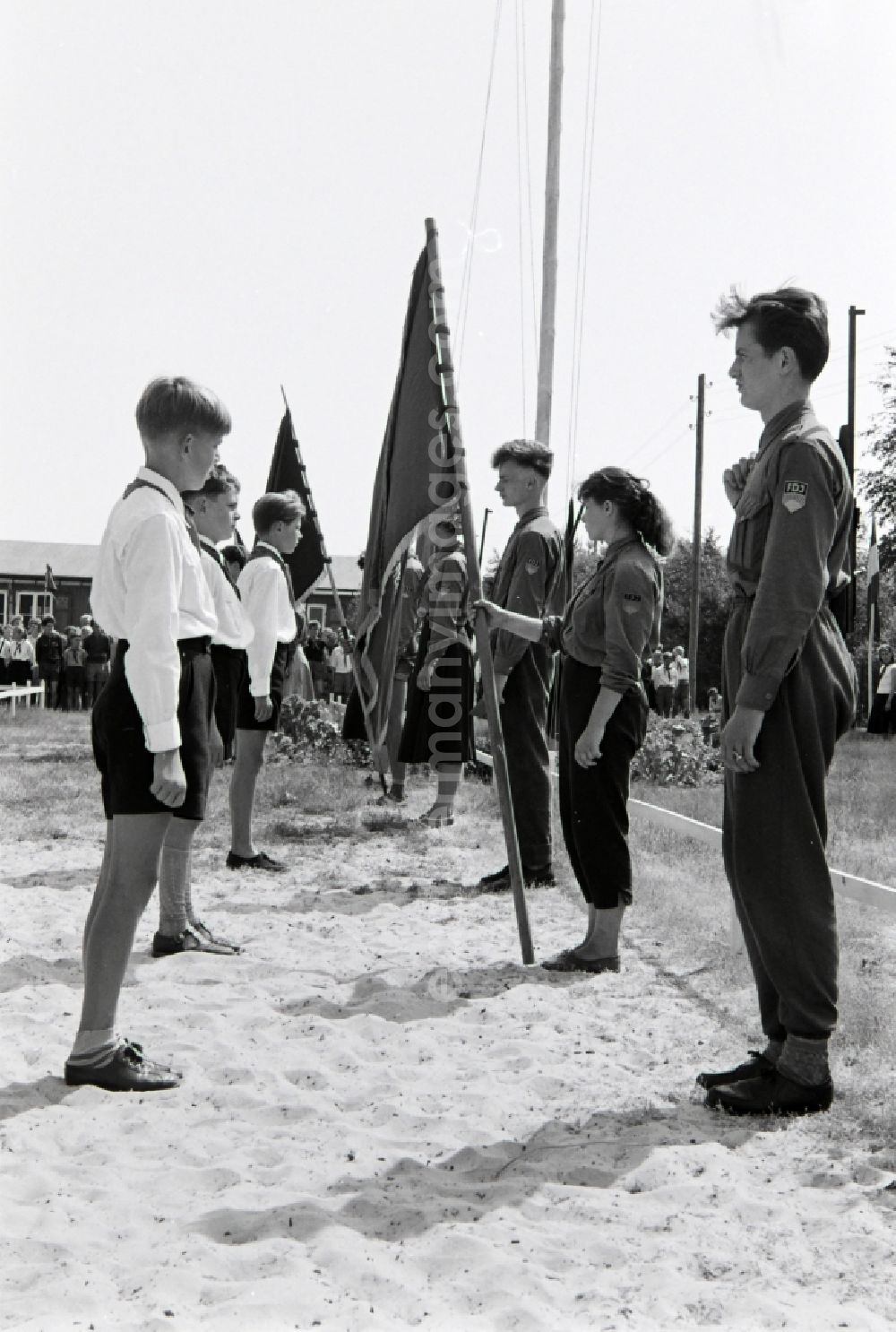 GDR image archive: Prerow - Summer camp operation with pupils and teenagers in the summer camp Kim Ir Sen of the pioneer organization Ernst Thaelmann in Prerow in the state Mecklenburg-Western Pomerania on the territory of the former GDR, German Democratic Republic. With homemade phantasy uniforms and pre-military drill and ante-exercises, the communist tradition was commemorated in the Spanish Civil War