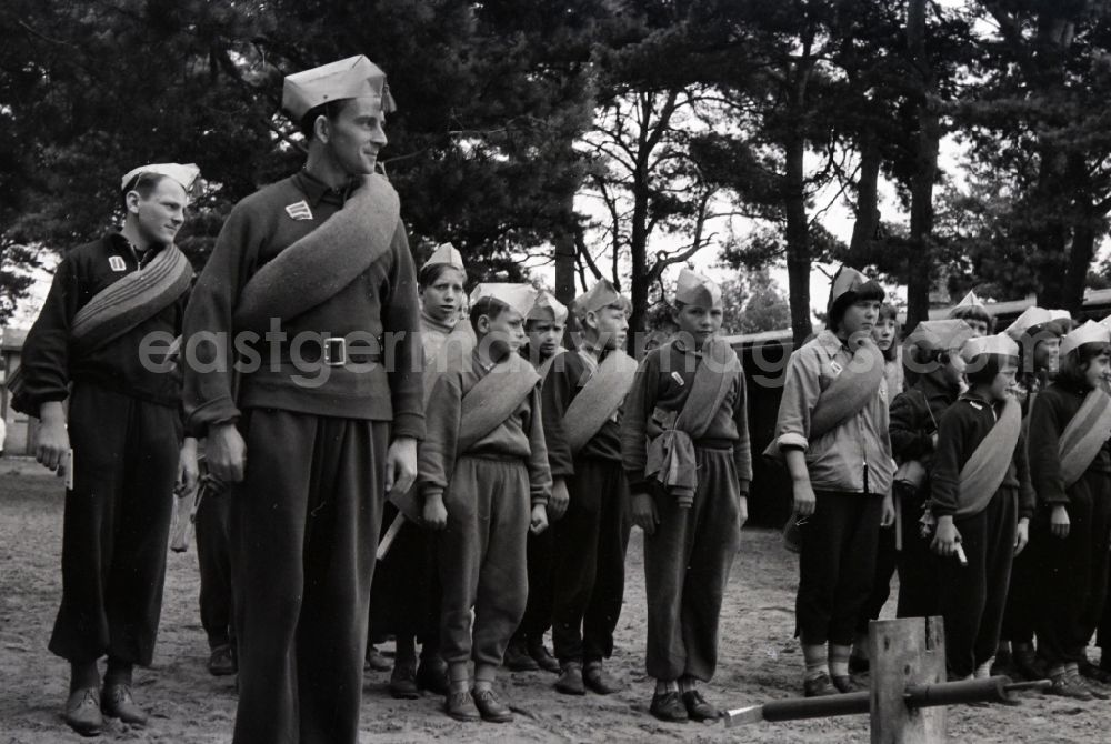 GDR picture archive: Prerow - Summer camp operation with pupils and teenagers in the summer camp Kim Ir Sen of the pioneer organization Ernst Thaelmann in Prerow in the state Mecklenburg-Western Pomerania on the territory of the former GDR, German Democratic Republic. With homemade phantasy uniforms and pre-military drill and ante-exercises, the communist tradition was commemorated in the Spanish Civil War