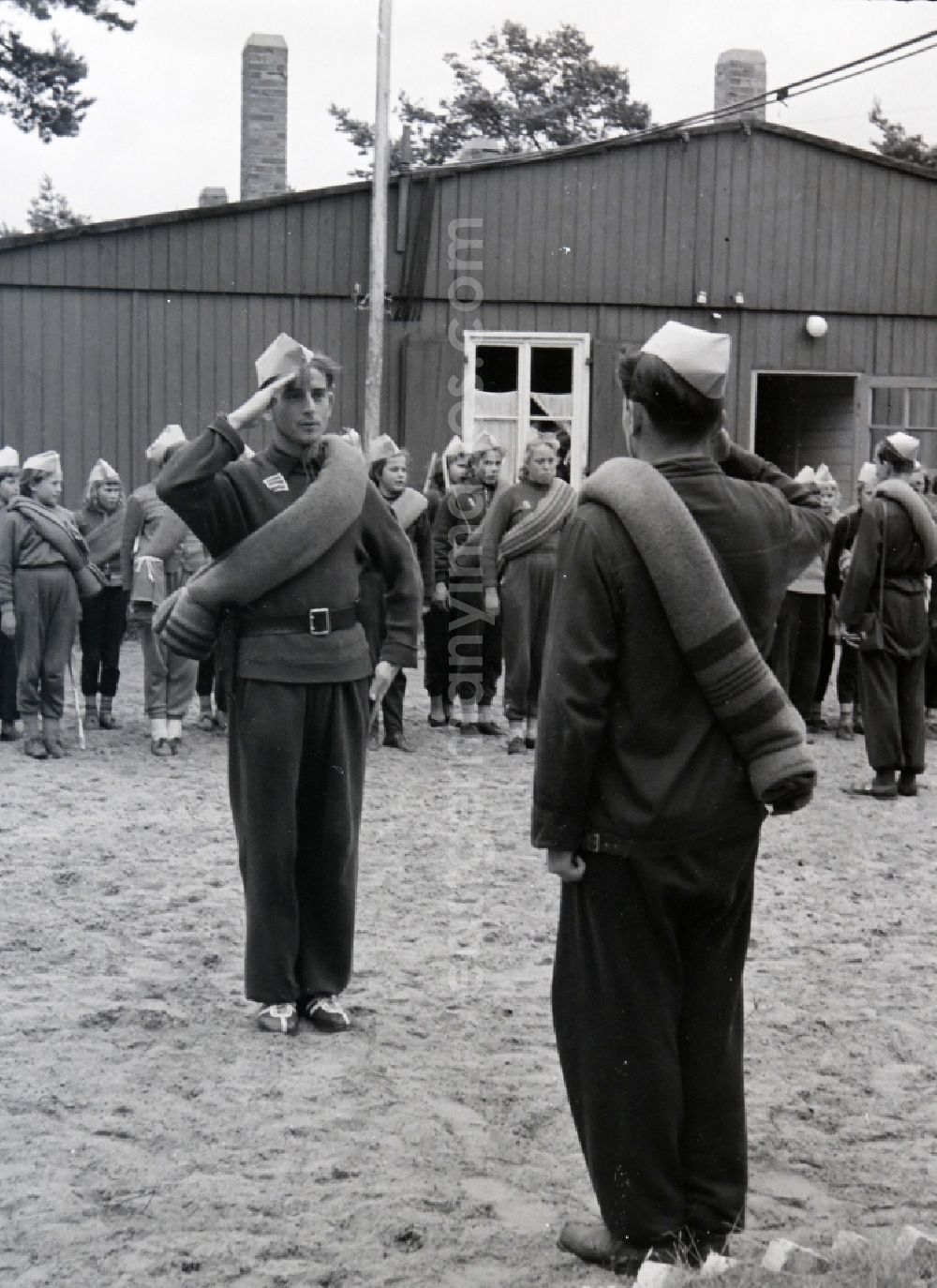 Prerow: Summer camp operation with pupils and teenagers in the summer camp Kim Ir Sen of the pioneer organization Ernst Thaelmann in Prerow in the state Mecklenburg-Western Pomerania on the territory of the former GDR, German Democratic Republic. With homemade phantasy uniforms and pre-military drill and ante-exercises, the communist tradition was commemorated in the Spanish Civil War