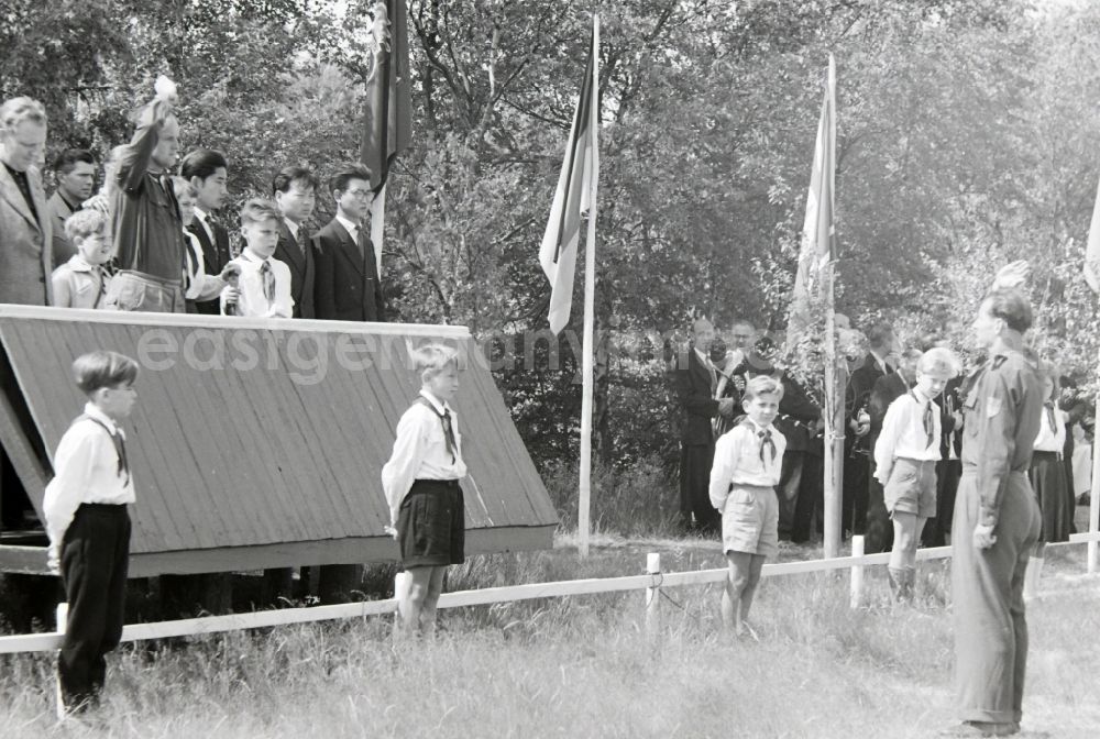 GDR picture archive: Prerow - Summer camp operation with pupils and teenagers in the summer camp Kim Ir Sen of the pioneer organization Ernst Thaelmann in Prerow in the state Mecklenburg-Western Pomerania on the territory of the former GDR, German Democratic Republic. With homemade phantasy uniforms and pre-military drill and ante-exercises, the communist tradition was commemorated in the Spanish Civil War