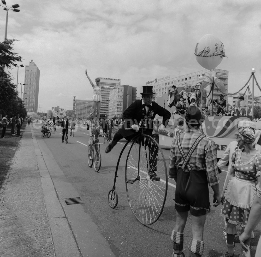 GDR picture archive: Berlin - Friedrichshain - Jubilee procession through the city center to mark the 750th anniversary of the city of Berlin. A penny-farthing in the big parade to represent the evolution of technology and the traffic after 190