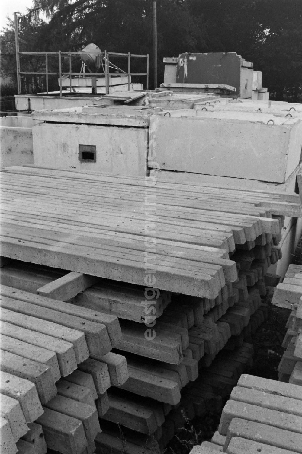 GDR photo archive: Berlin - Fragments of the decaying and dismantled watchtower concrete elements of the border fortifications and wall as well as security structures in the former blocking strip of the state border at a camp of the border troops in the district of Steinstuecken in Berlin on the territory of the former GDR, German Democratic Republic