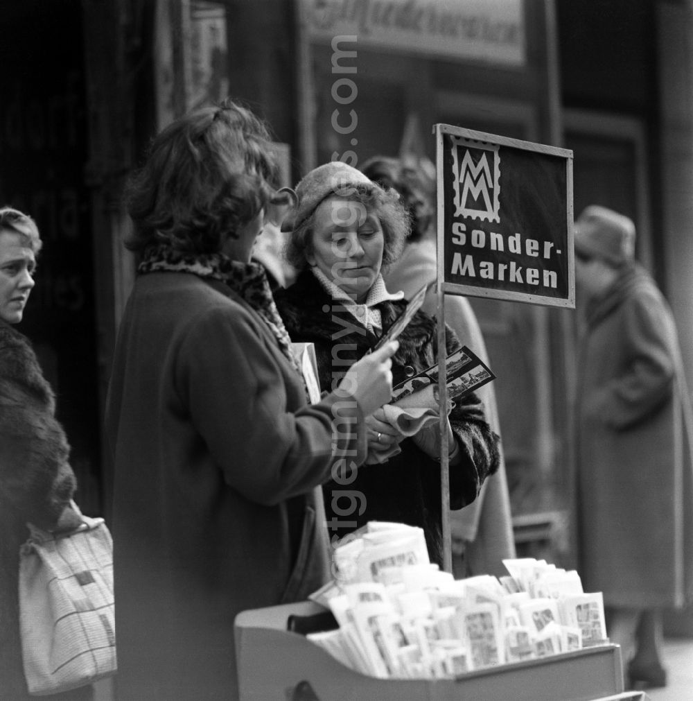 Berlin: Women look at special postage stamps in Berlin Eastberlin on the territory of the former GDR, German Democratic Republic