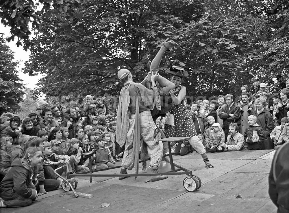 GDR image archive: Berlin - Actors and performers of a theater scene and stage design on an open-air stage on the occasion of a folk festival in the park at the Weberwiese in the Friedrichshain district of Berlin East Berlin in the area of ??the former GDR, German Democratic Republic