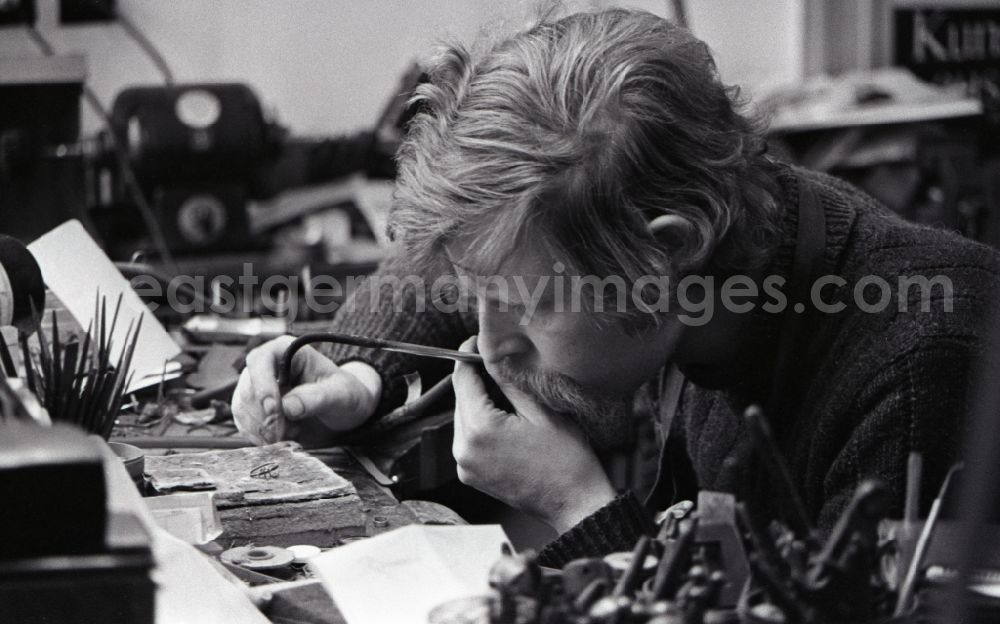 GDR photo archive: Berlin - Goldsmith at work making jewelry in the district Mitte in Berlin, the former capital of the GDR, German Democratic Republic