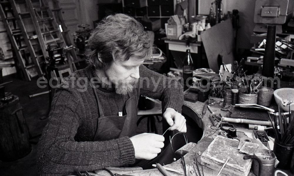GDR picture archive: Berlin - Goldsmith at work making jewelry in the district Mitte in Berlin, the former capital of the GDR, German Democratic Republic