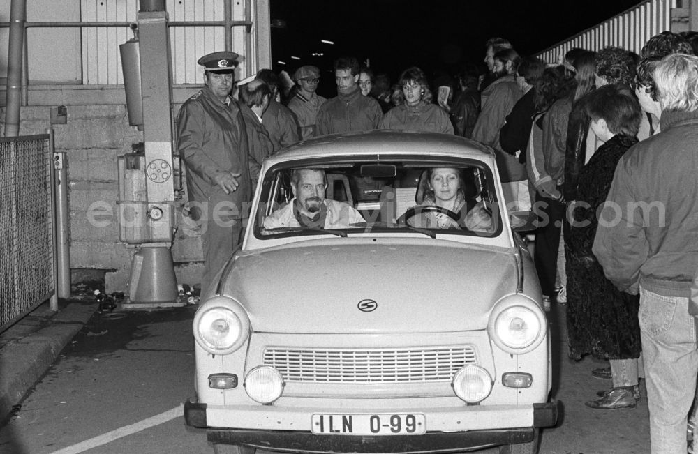 GDR photo archive: Berlin - On the evening of the fall of the Berlin Wall, a Trabant car drives from East Berlin to West Berlin at the border crossing point Invalidenstrasse in the district Mitte in Berlin, the former capital of the GDR, German Democratic Republic