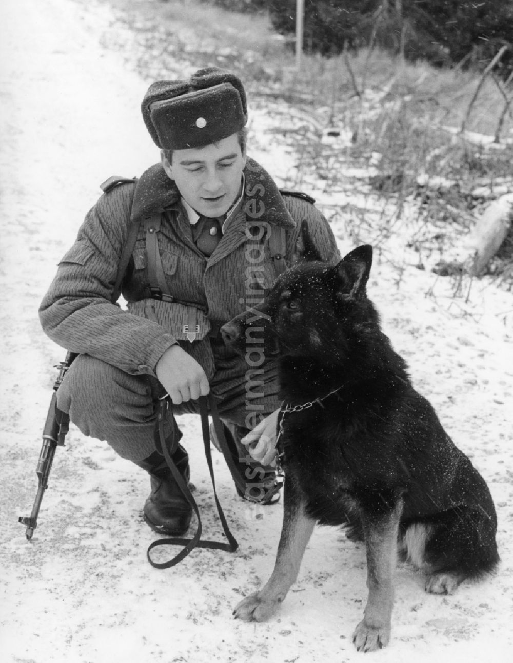 GDR photo archive: Abbenrode - Border Patrol with dog near Abbenrode in today's federal state of Saxony-Anhalt. Here to see a guard, equipped with machine gun AK-47