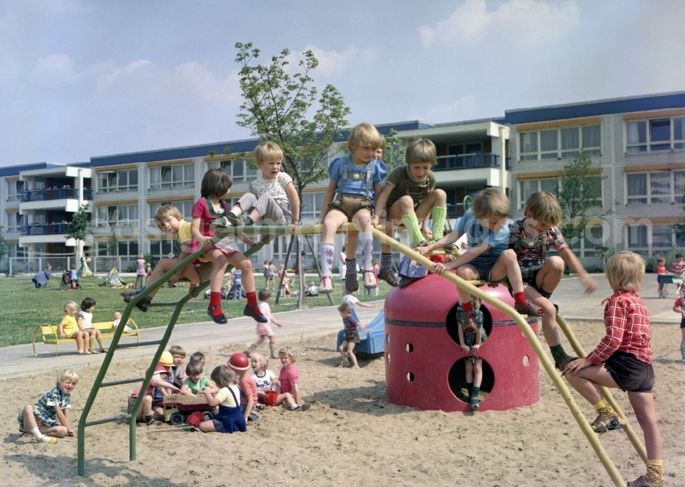 GDR picture archive: Rostock - Fun and games for children and teenagers on a climbing arch - playground in Rostock in the state Mecklenburg-Western Pomerania on the territory of the former GDR, German Democratic Republic