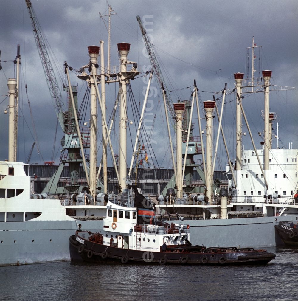 Rostock: Merchant ships in the seaport of Rostock in Mecklenburg - Western Pomerania. Here during loading at the port. By the division of Germany resulted in the need to build on the Baltic coast of East Germany a seaport