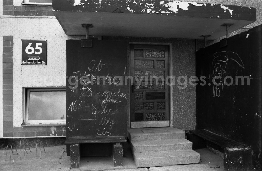 GDR photo archive: Berlin - House entrance and facade of the building front Hellersdorfer Strasse 65 in the district Marzahn in Berlin on the territory of the former GDR, German Democratic Republic
