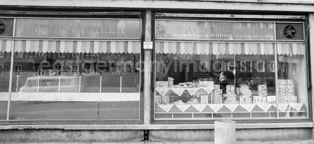 GDR picture archive: Berlin - House front and Shopwindow for groceries retail store in the borough Berlin-Pankow or Prenzlauer Berg