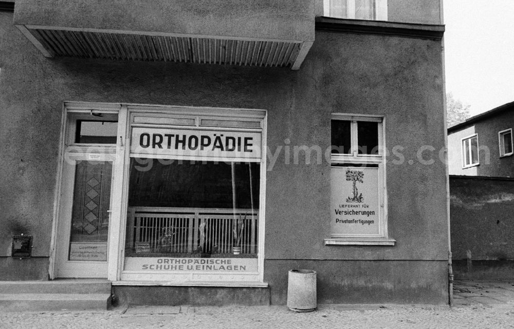 GDR picture archive: Berlin - House front and Shopwindow for orthopedics store in the borough Berlin-Pankow or Prenzlauer Berg