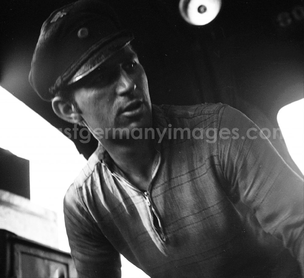 GDR image archive: Halberstadt - Portrait shot a stoker in the driver's cab of a class steam locomotive 41 1116 in Halberstadt in the state Saxony-Anhalt on the territory of the former GDR, German Democratic Republic