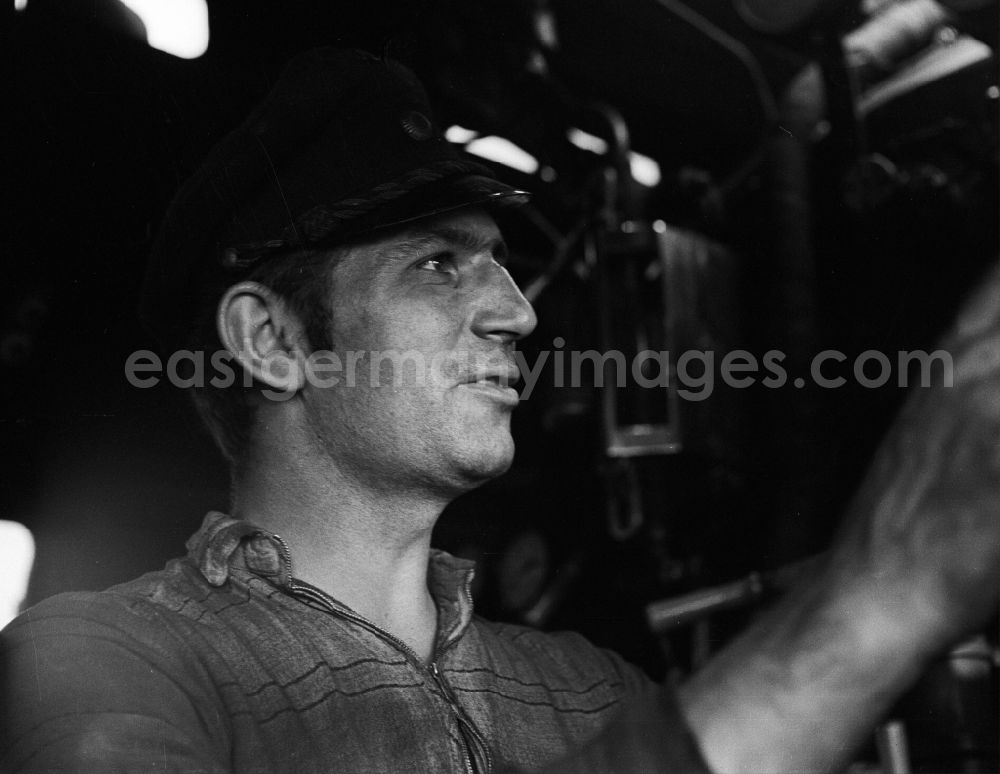 GDR photo archive: Halberstadt - Portrait shot a stoker in the driver's cab of a class steam locomotive 41 1116 in Halberstadt in the state Saxony-Anhalt on the territory of the former GDR, German Democratic Republic