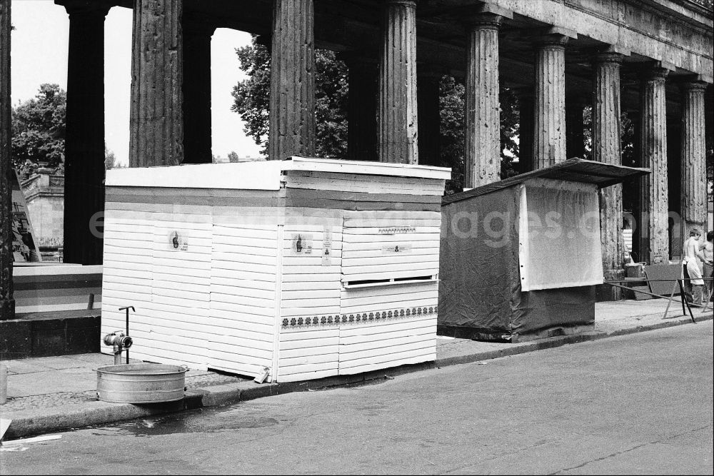 GDR photo archive: Berlin - Wooden stalls at the colonnade in Berlin on the territory of the former GDR, German Democratic Republic