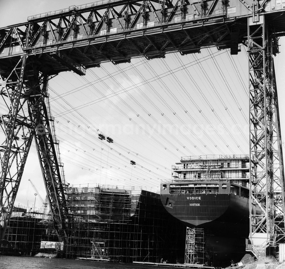 GDR picture archive: Warnemünde - Construction of a container ship of the type equator named VODICE the VEB Warnow Werft shipyard Warnemuende in Warnemuende in Mecklenburg-Western Pomerania in the field of the former GDR, German Democratic Republic. The cruise ship was built for Yugoslavia