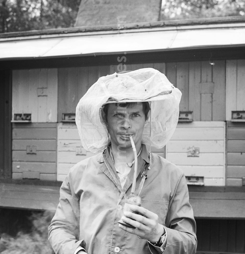 GDR photo archive: Glöwen, Plattenburg - Beekeepers Beekeepers with helmet and aluminum smoke blower in front of his bee wagons in Gloewen in plate castle in what is now the state of Brandenburg