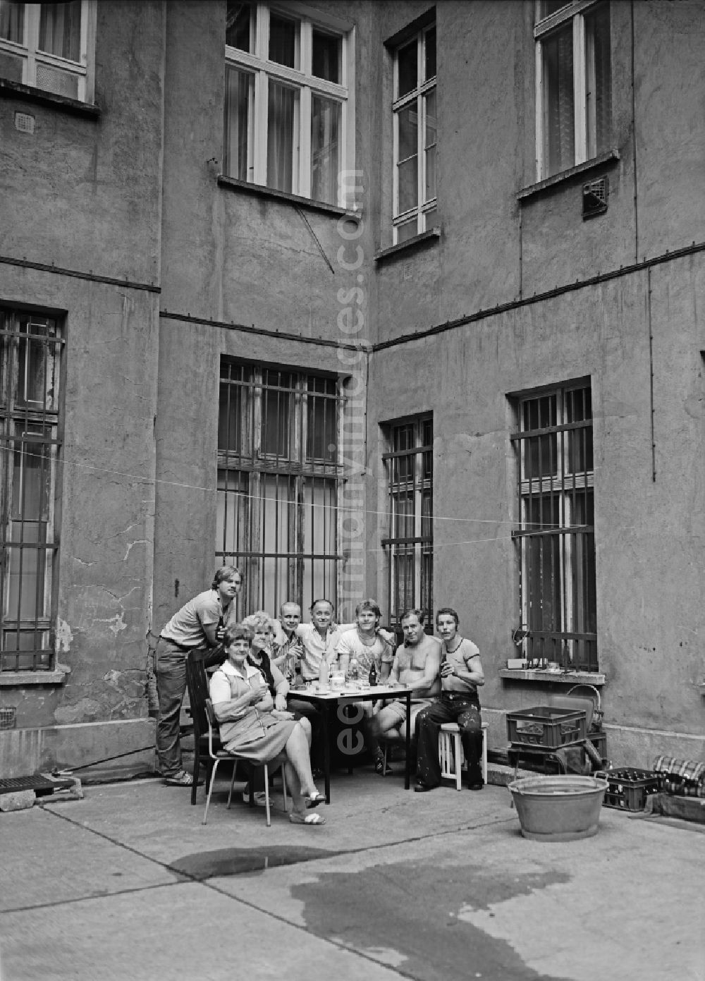 GDR image archive: Berlin - Apartment building courtyard areawith a happy gathering of the household in Berlin Eastberlin on the territory of the former GDR, German Democratic Republic