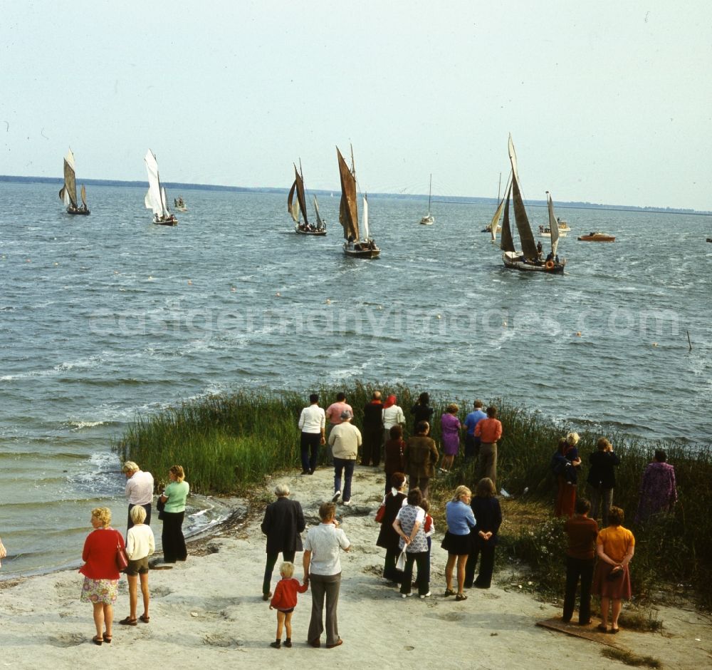 GDR photo archive: Rostock - International sailing event in Warnemuende in Rostock in today's State of MMecklenburg-Western Pomerania. Already since 1926, national and international regattas were held in Warnemunde sailing. From 1958 to 1975, referred to as the Baltic Sea Regatta, was Warnemuende Sailing Week in GDR times as a counterpart to the Kieler Woche. It is now a permanent fixture in the calendar of the regatta sailors worldwide