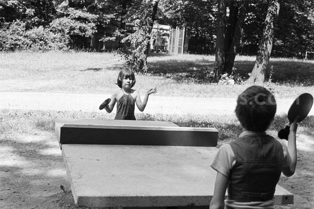 GDR photo archive: Dresden - On Children´s day two kids playing table tennis on the premises of the pioneer palace Dresden in the state Saxony on the territory of the former GDR, German Democratic Republic