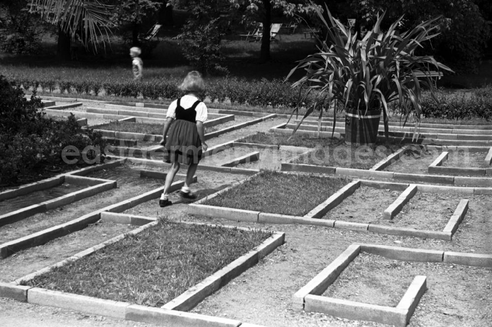 GDR picture archive: Bad Dürrenberg - Children play in a crazy garden in Bad Duerrenberg in the federal state Saxony-Anhalt in Germany