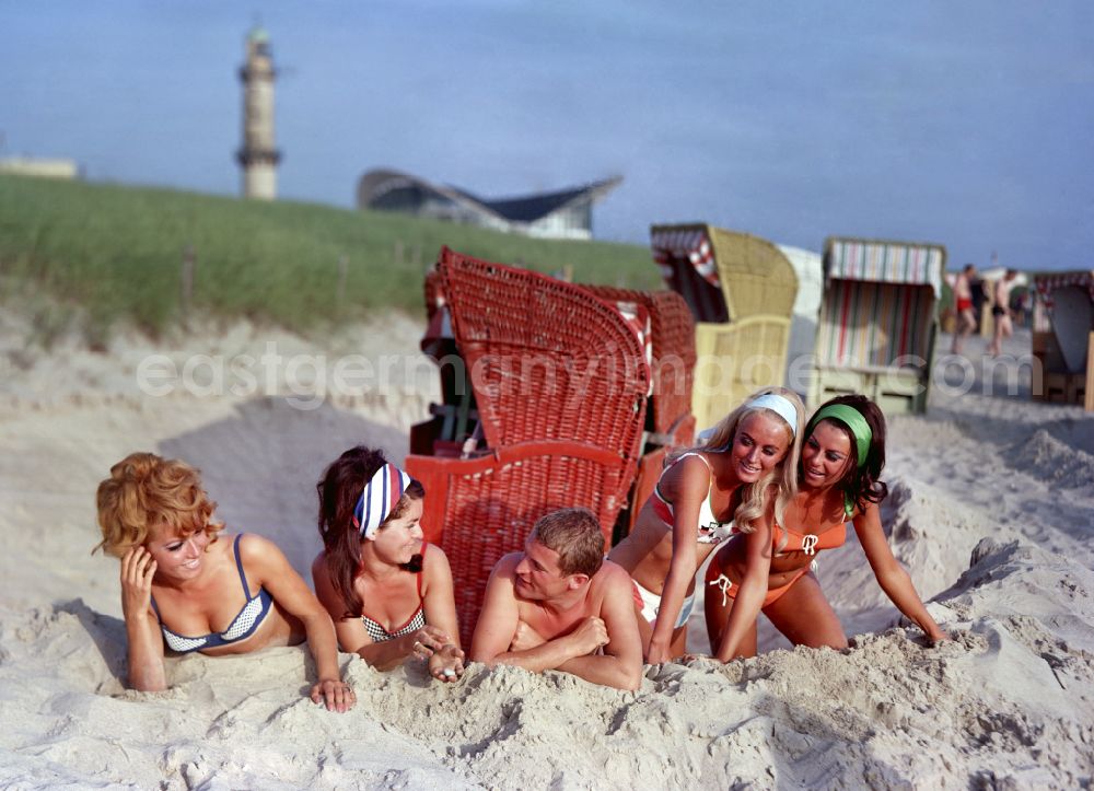 GDR image archive: Rostock - Young people present the latest summer swimwear on the Baltic Sea beach in the district Warnemuende in Rostock in the state Mecklenburg-Western Pomerania on the territory of the former GDR, German Democratic Republic