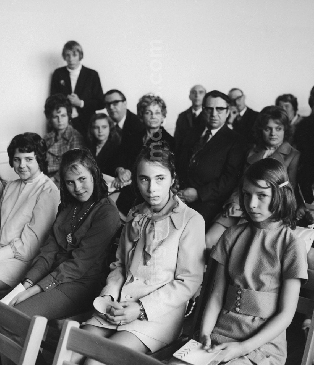 Berlin: Youth Dedication Ceremony participants sitting on chairs and waiting in Berlin, the former capital of the GDR, the German Democratic Republic