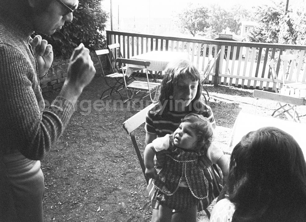 GDR picture archive: Altenberg - A young family in an excursion restaurant in Altenberg in the federal state of Saxony on the territory of the former GDR, German Democratic Republic