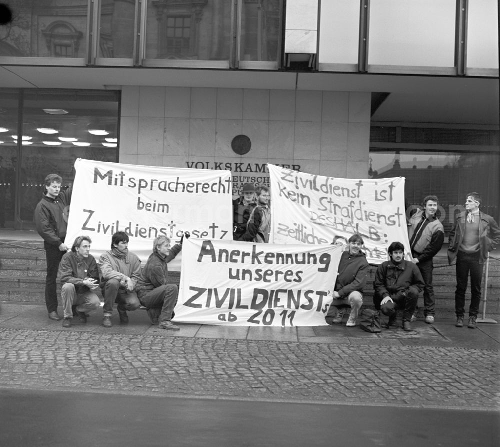 Berlin: Young men demonstrate in front of the parliament of the GDR in Berlin for the recognition of their community service
