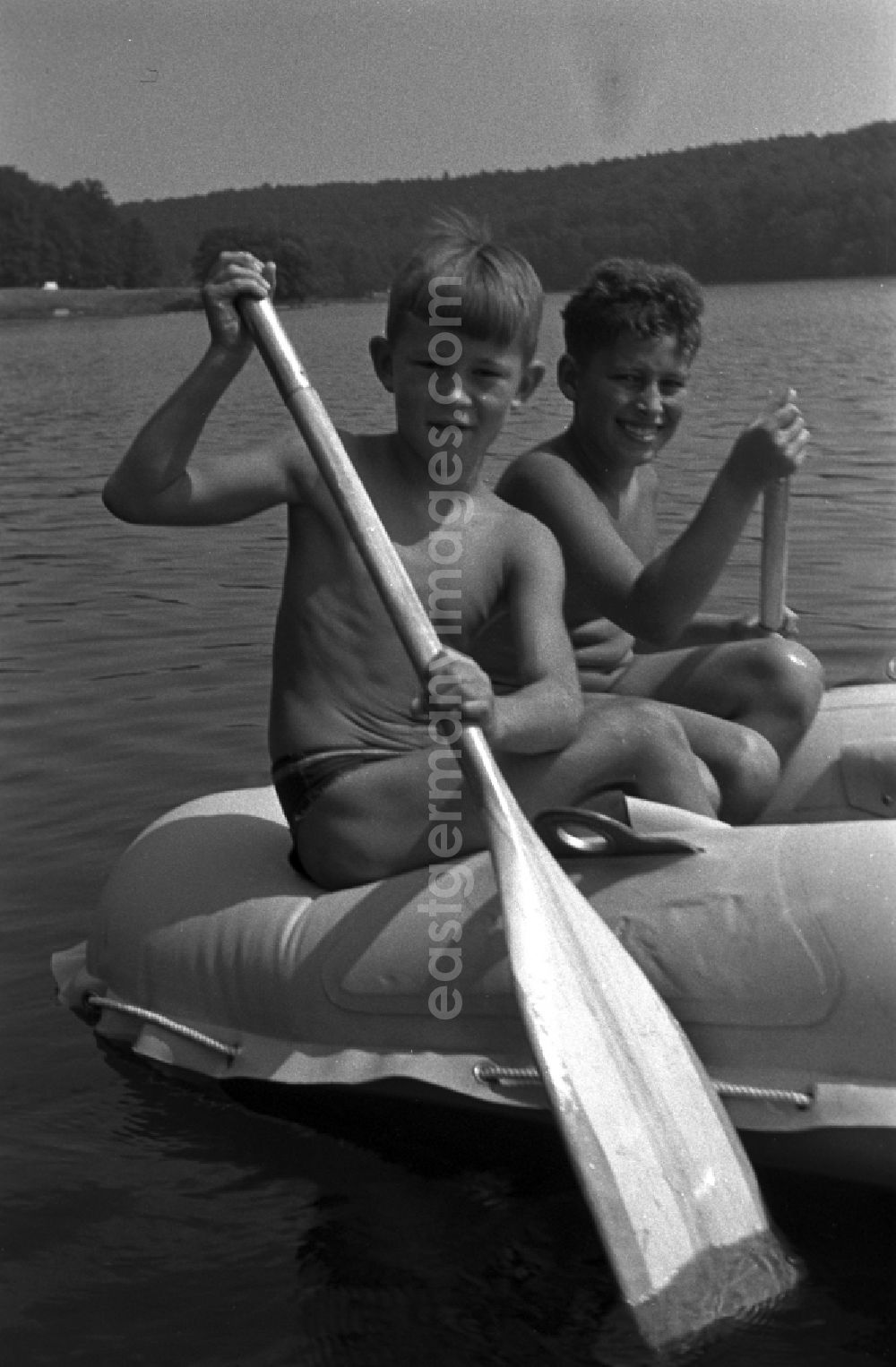 GDR photo archive: Neuruppin OT Stendenitz - 2 guys in a dinghy with paddles on the Tornowsee in Brandenburg