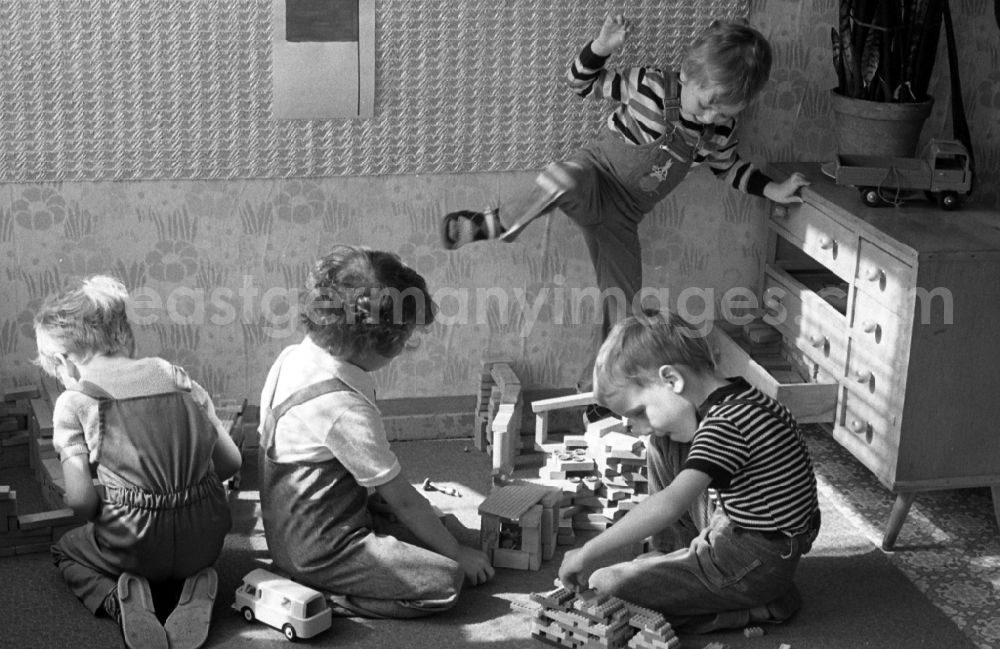 GDR picture archive: Berlin - Boys playing with building blocks in a kindergarten in Berlin Eastberlin on the territory of the former GDR, German Democratic Republic