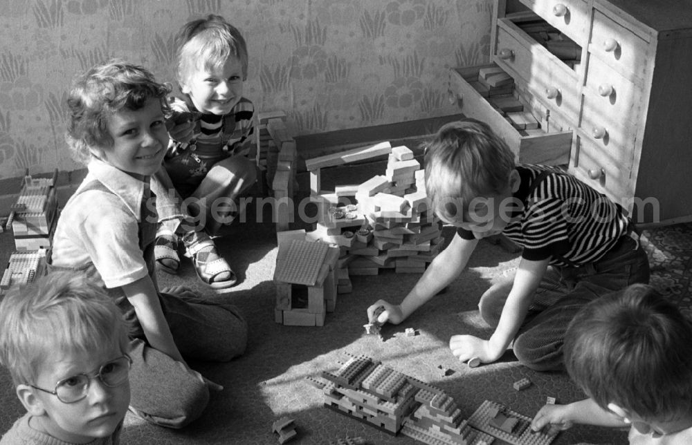 Berlin: Boys playing with building blocks and FORMO bricks in a kindergarten in Berlin Eastberlin on the territory of the former GDR, German Democratic Republic