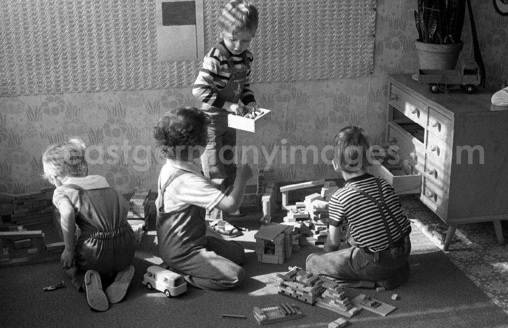 GDR photo archive: Berlin - Boys playing with building blocks and FORMO bricks in a kindergarten in Berlin Eastberlin on the territory of the former GDR, German Democratic Republic