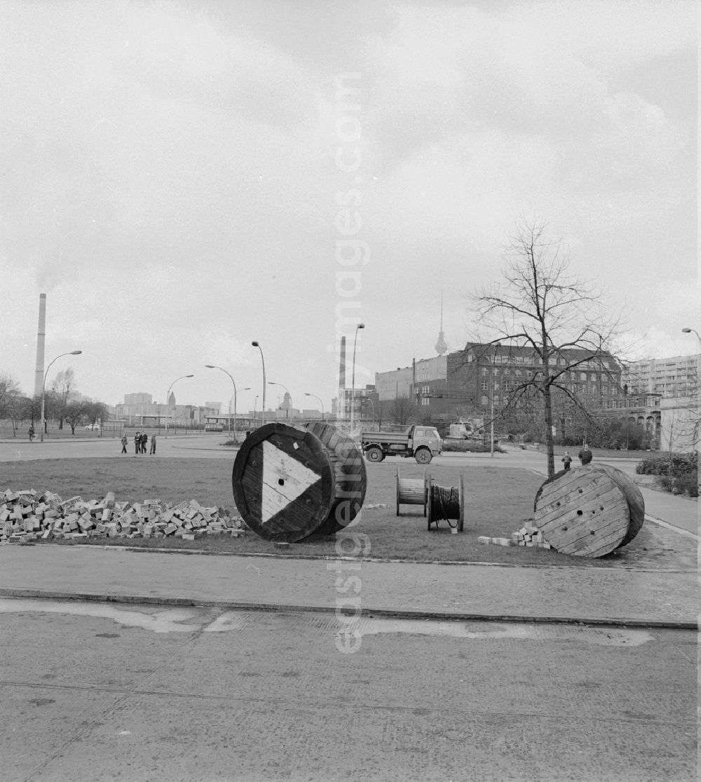 GDR photo archive: Berlin - Cable drums and bricks stored on a meadow in Berlin - Friedrichshain