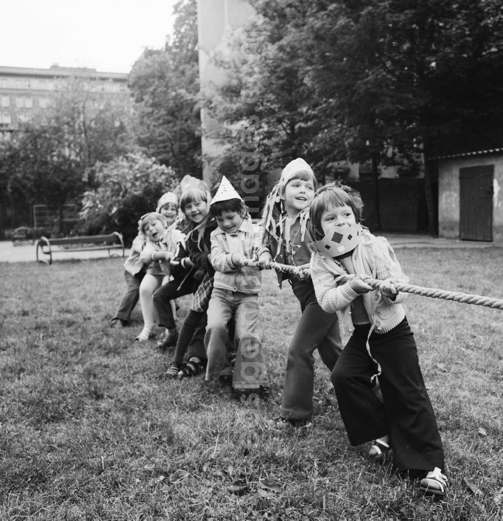 GDR photo archive: Berlin - Children at the tug of war in nursery school in Berlin