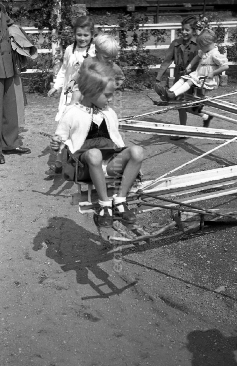 GDR photo archive: Bad Dürrenberg - Children sit on a carousel in bath Drought mountain in the federal state Saxony-Anhalt in Germany
