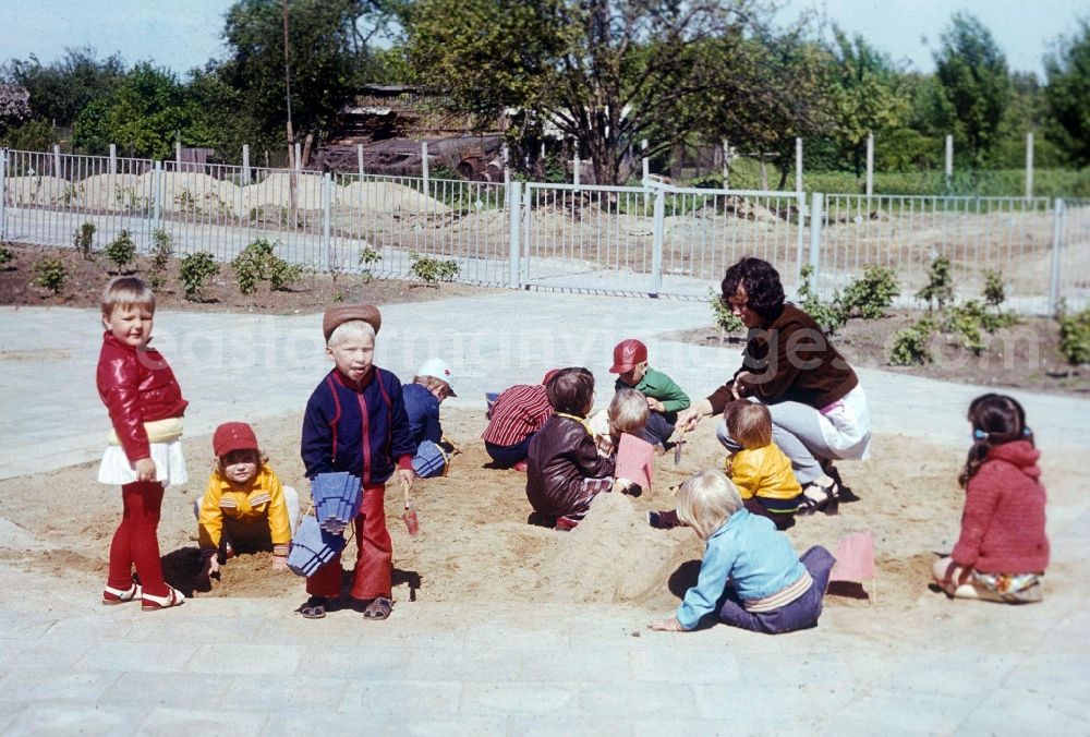 GDR picture archive: Bernau bei Berlin - Children play in the garden of a daycare center in Bernau near Berlin in the state of Brandenburg on the territory of the former GDR, German Democratic Republic